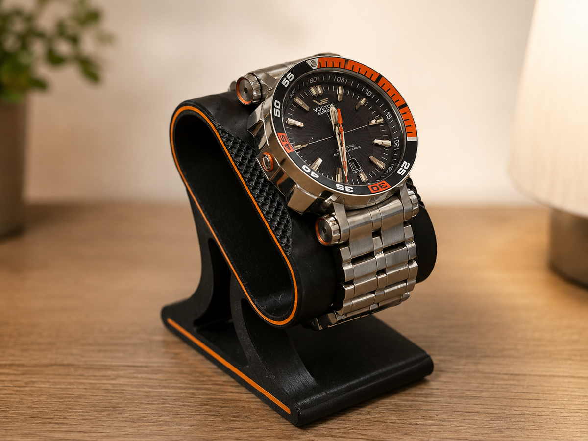 Watch displayed on a modern watch stand.